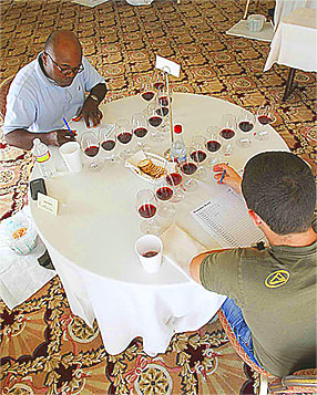 Anani Lawson of Per Se and Will Costello of Addison study a flight of red wines at Sommelier Challenge II.